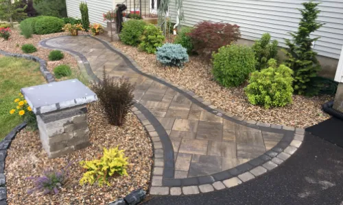 Front Yard Makeover With New Paver Pathway And Low Maintenance Garden Beds, Designed and Installed By Scenic Landscaping & Property Maintenance.