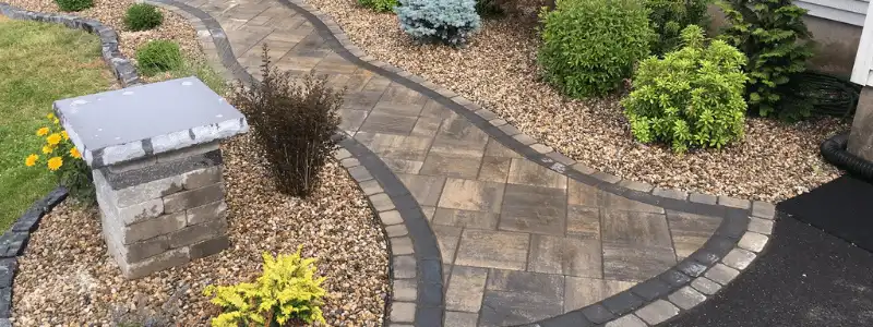 paver walkway with surrounding low maintenance garden beds