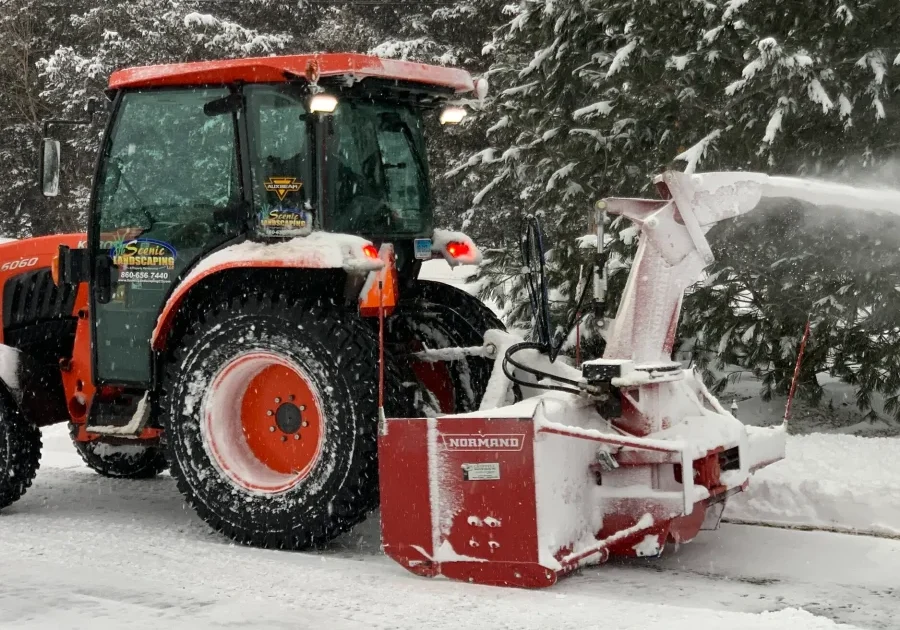 tractor blowing snow