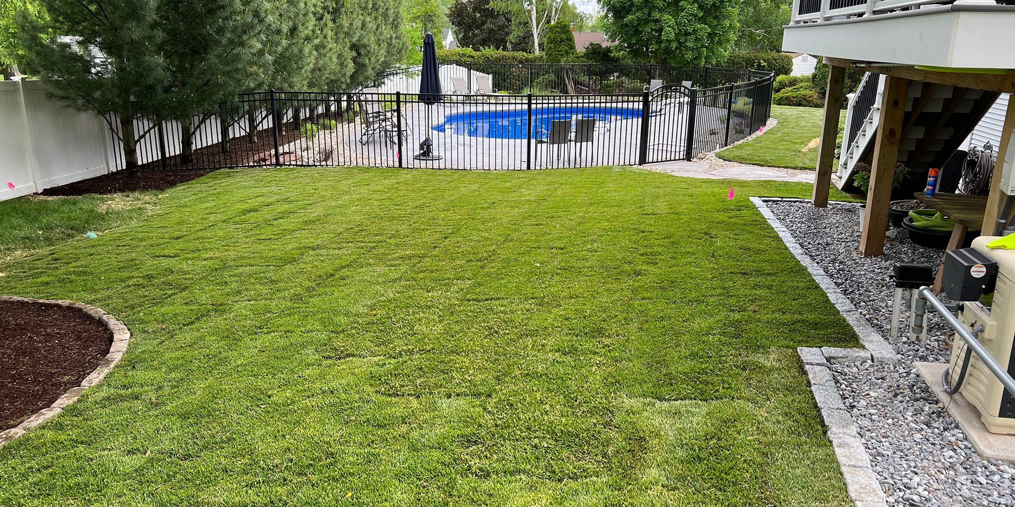 Sod installation around pool deck